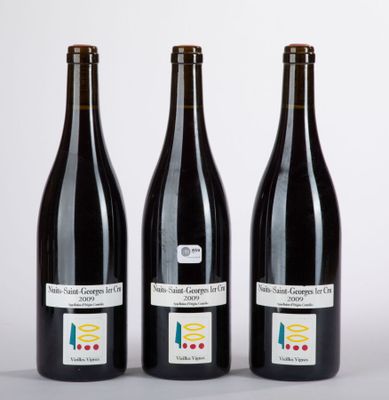 three bottles of wine sitting next to each other on a table