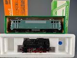 a box with a train on top of it next to a box with a train on it