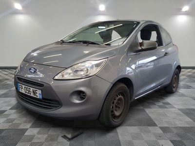 a picture of a small car parked in a garage