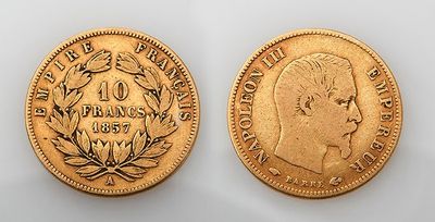 two gold coins, one of which is the head of a man and the other of a woman