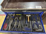 many tools in a tool box on the floor