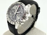 a watch that is sitting on a stand on a white surface