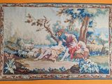 une image représentant une tapisserie sur laquelle figurent un homme et une femme dans un décor boisé