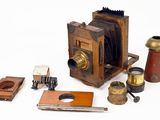 many different types of antique cameras on the table