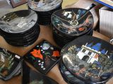 a lot of plates that are sitting on a table