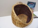 a wicker basket with a red and black checkered lining