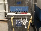 a machine that is sitting next to some buckets