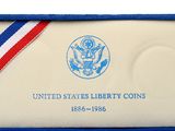 an image of a blue and white medal with a red, white, and blue ribbon