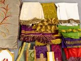 many different types of cloths laid out on a table