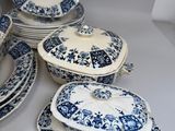 several blue and white plates and bowls are stacked on top of each other