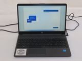 a laptop that is sitting on a table with a mouse
