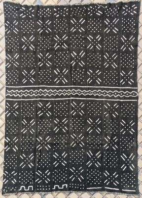 a black and white blanket with a pattern on it