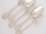 five forks and spoons are lined up on a white surface