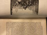 an open book with a picture of a group of people on it
