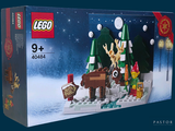 une boîte de Lego sur laquelle est représentée une scène de Noël