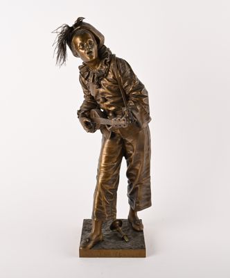 bronze statue of a man with a hat and jacket on a white background