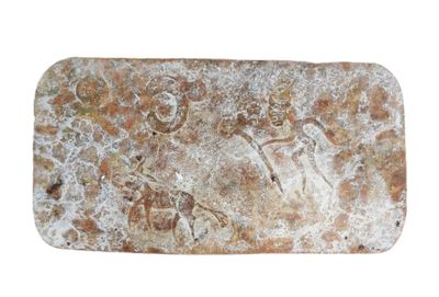 an image of a piece of stone with a man and a woman on it