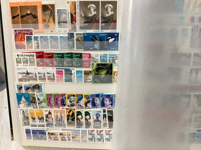 a refrigerator with a bunch of stamps on it