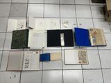 a lot of books that are laying on the floor