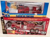 a red toy fire truck with a man on top of it