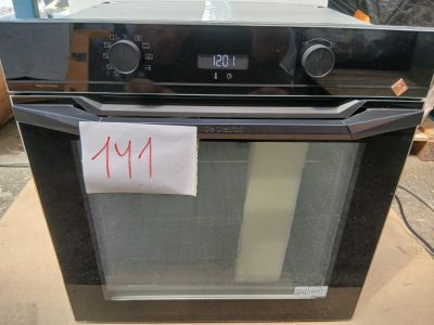 a black oven sitting on top of a cardboard box with a price tag on it