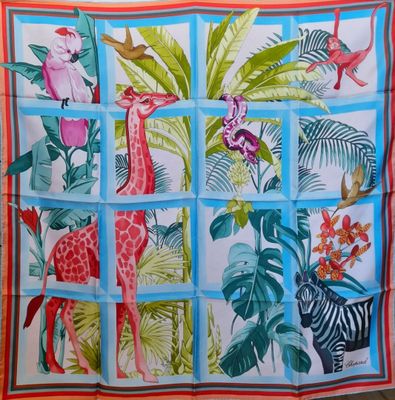 a picture of a scarf with a giraffe and zebras on it