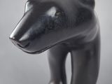 sculpture of a black bear on a white background