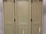 three paneled room divider with arched glass doors