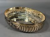 a silver bowl that is sitting on a table