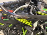 a close up of a motorcycle parked in a garage