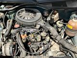 a picture of a car engine with its hood open