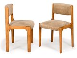 two wooden chairs with upholstered upholstered seats on a white background
