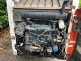 a truck with a large engine in the back of it