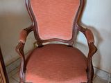 a chair that is sitting in the corner of a room