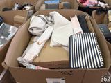 a box full of clothes and other items in a store