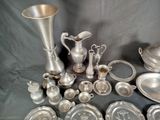 a lot of silver items that are on a table