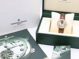 a box with a watch inside of it on a table
