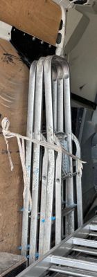 a ladder that is attached to the back of a truck