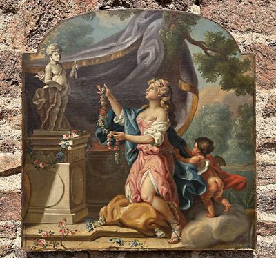 une peinture accrochée au mur d'un immeuble représentant une femme et un enfant