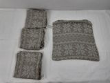 several pieces of cloth are laid out on a white surface