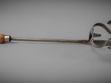a metal spoon with a wooden handle sitting on a table