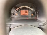 a close up of a car dashboard with a clock on it