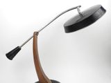 a black lamp with a wooden base on a white background