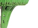 a green vase on a stand with a knife in it