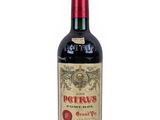 bottle of red wine on a white background with a red cap