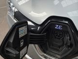 a close up of an electric car charging at a charging station