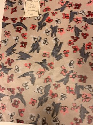 a bag with a bird pattern on it sitting on a table