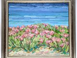 painting of pink flowers by the ocean in a silver frame