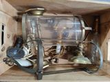 a wooden box with a glass bottle on top of it