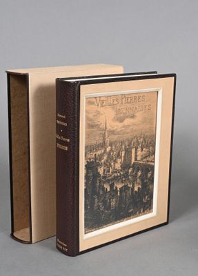 an old book with a picture of a city in it